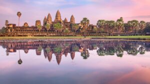 Angkor,Wat,Temple,At,Dramatic,Sunrise,Reflecting,In,Water
