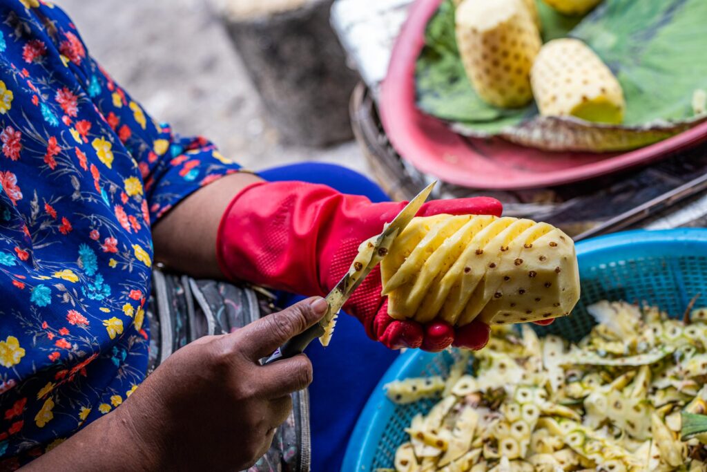 Battambang - Women Cutting Pineapple Market fareast247